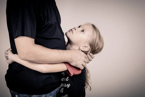 Portrait of one sad daughter hugging her father — Stock Photo, Image