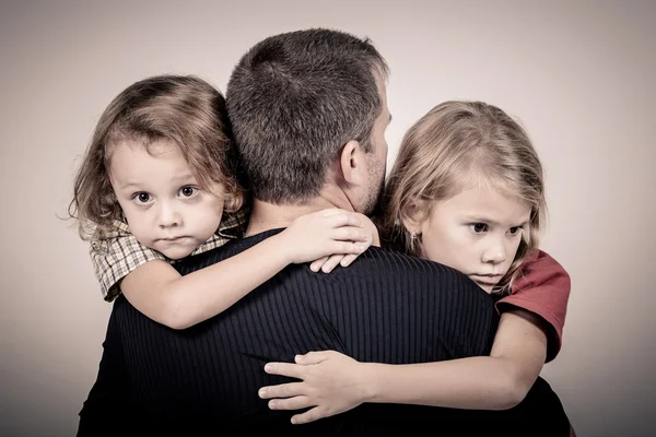 Portrait of one sad children hugging her father — Stock Photo, Image