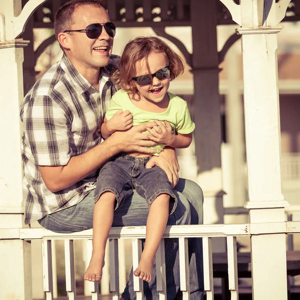 Father and son playing near the house at the day time. — Stock Photo, Image