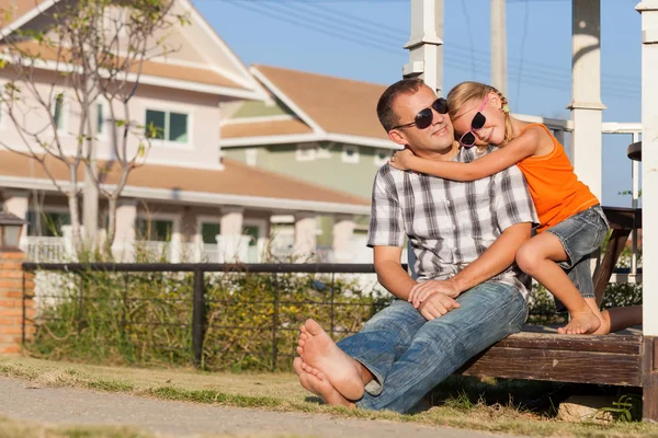 Father and daughter playing near the house at the day time. — Stock Photo, Image
