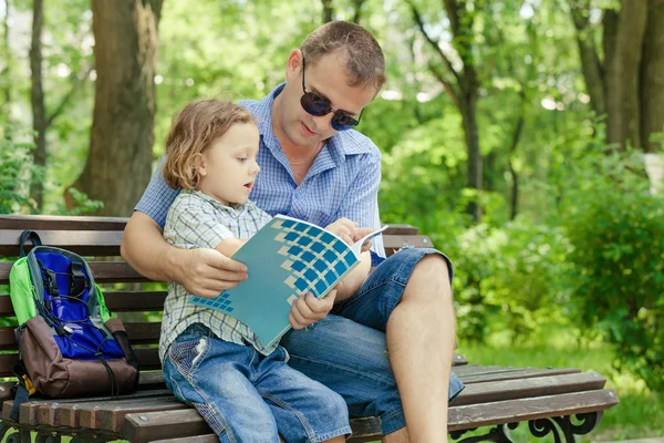 Father and son playing at the park at the day time. — Stock Photo, Image