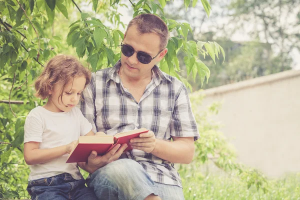 Father and son playing at the park at the day time. — Stock Photo, Image