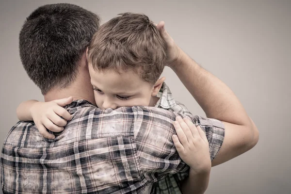 Sad son hugging his dad — Stock Photo, Image