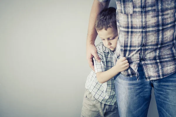 Sad son hugging his dad — Stock Photo, Image