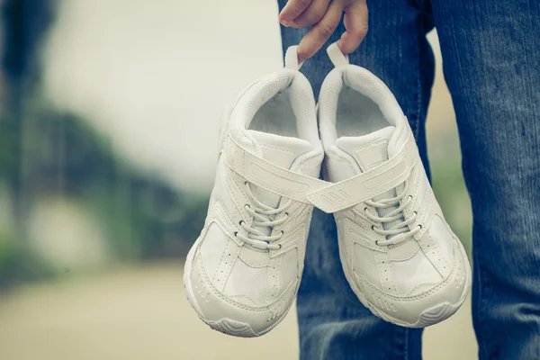 Youth sneakers on girl legs on road — Stock Photo, Image