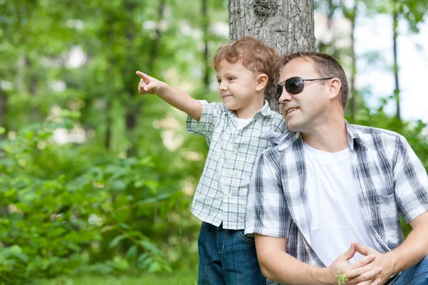 Father and son playing in the park at the day time. — Stock Photo, Image