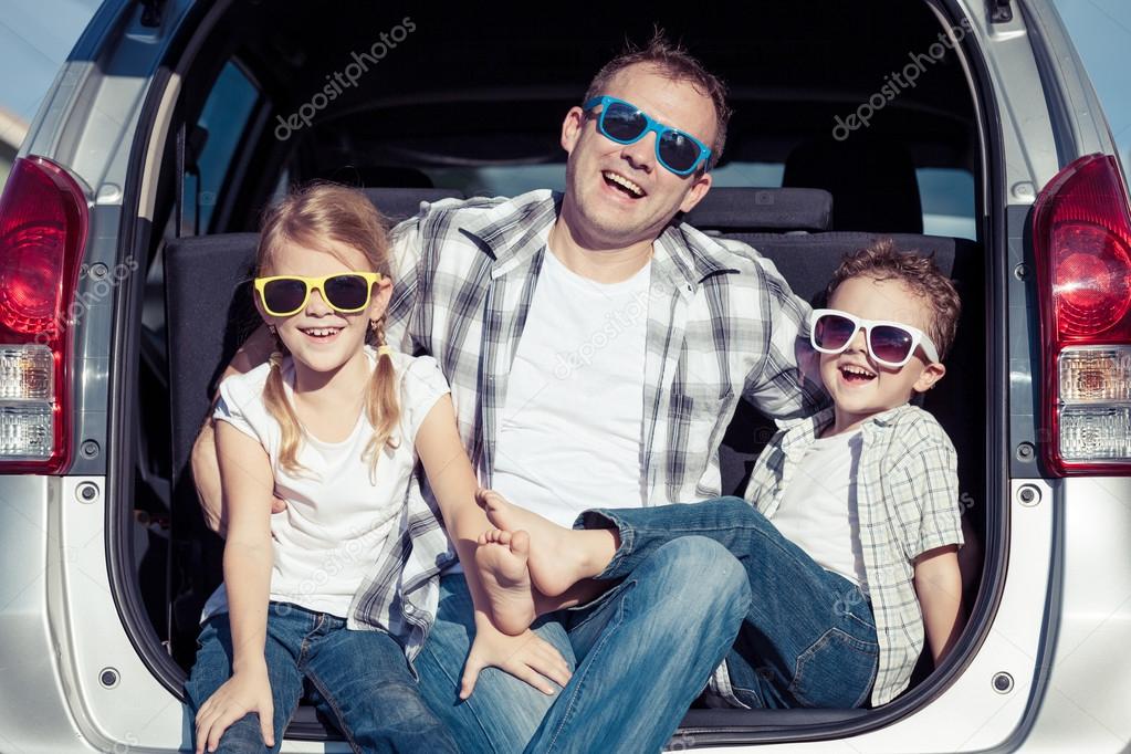 Happy family getting ready for road trip on a sunny day