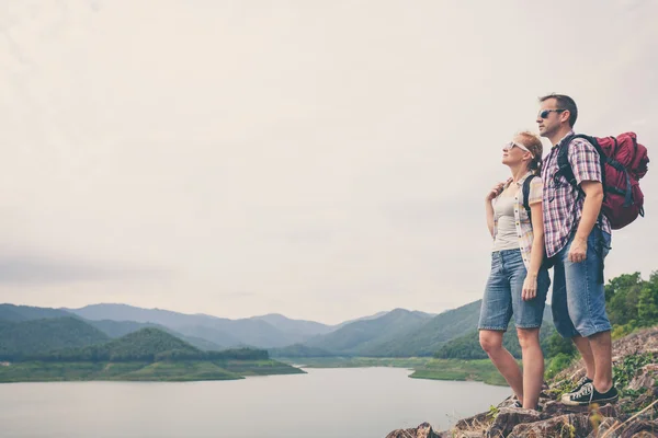 Happy family standing near the lake. — Stock Photo, Image