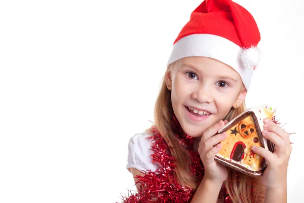 Felice bambina sorridente con la casa di Natale . — Foto Stock