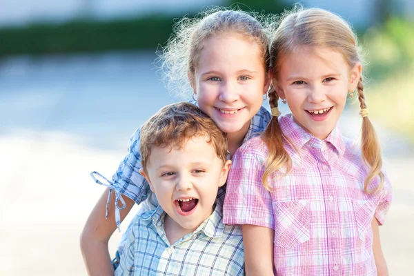 Portrait of happy children near a house — Stock Photo, Image