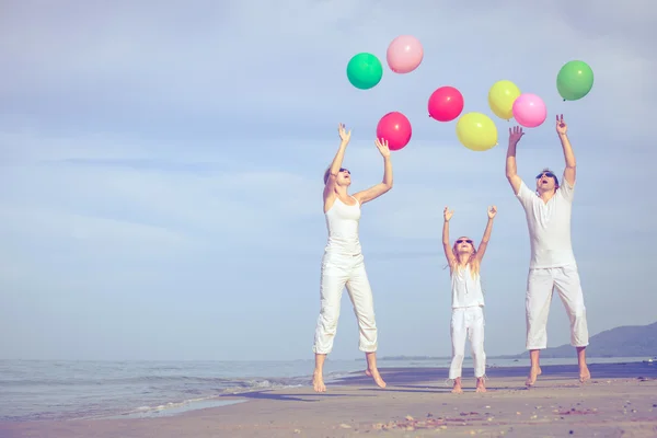 Happy family playing on the beach at the day time. — Stock Photo, Image