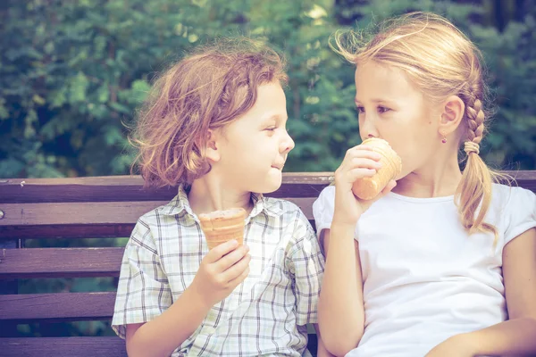 Two happy children  playing in the park at the day time. — Stock Photo, Image