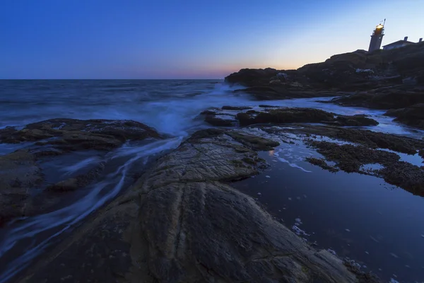 Sunset on a rocky shore. — Stock Photo, Image