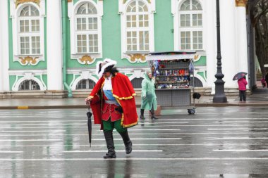 man in costume  near Winter Palace clipart