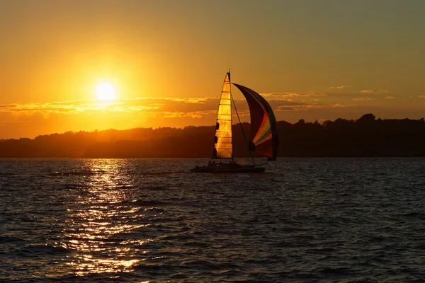 Sail boat at sunset. Royalty Free Stock Photos