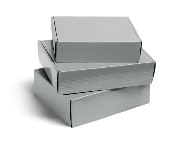 Три картонные коробки — стоковое фото