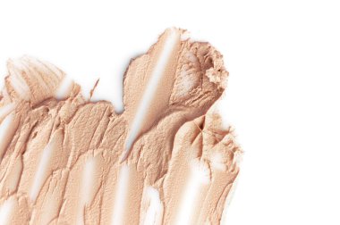 Yüz için sıvı temel dokusu. Makyaj, dekoratif kozmetik, beyaz arka planda izole edilmiş bej fondöten. Vakıf yüz makyajı örnekleri, yüz kapatıcı dokusu. Kozmetik arkaplan.