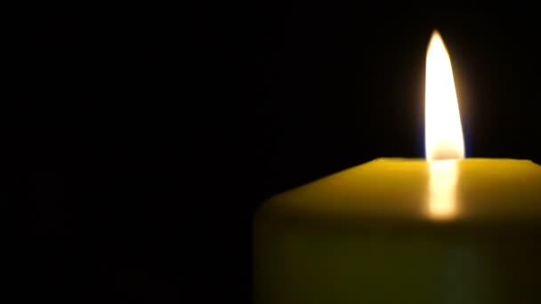 Footage burning candle isolated on black — Stock Video