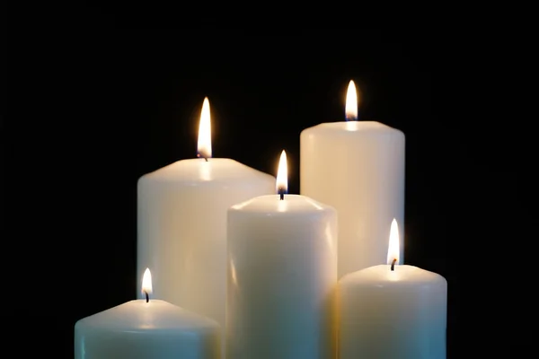 Burning candles isolated on black background. — Stock Photo, Image