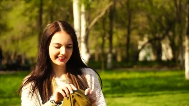 Woman wears Soviet military hat outdoors. — Stock Video