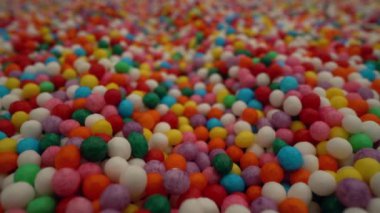 Renkli makro şekerleme serpme hareket arkaplanı