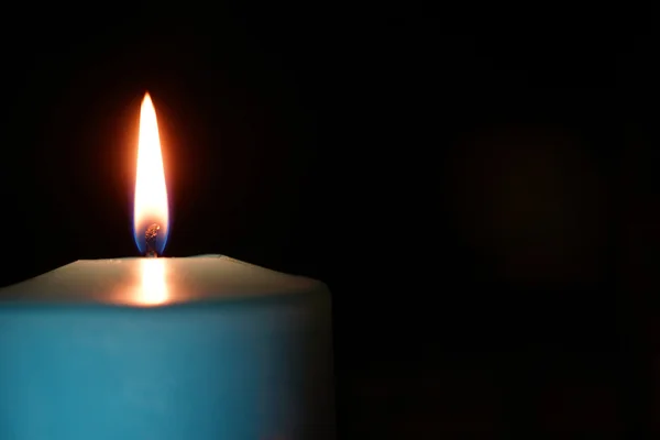 Burning candle isolated on black — Stock Photo, Image