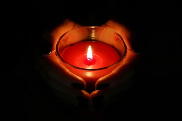 Burning candle in the hands — Stock Photo, Image