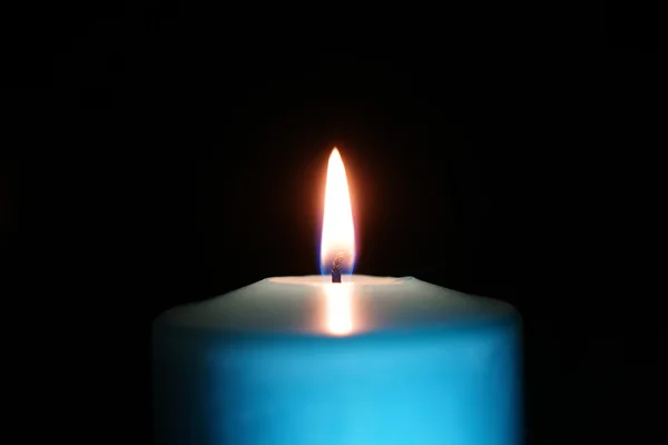 Burning candle isolated on black — Stock Photo, Image