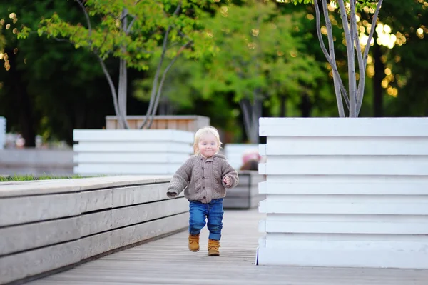 Toddler boy playing outdoors — Stock Photo, Image