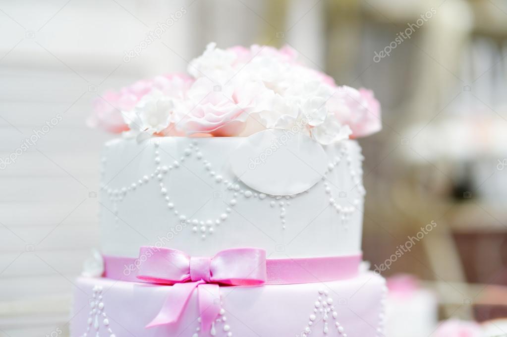 Wedding cake decorated with cream flowers