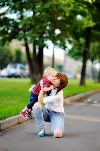 Happy young woman with her toddler son — Stock Photo, Image