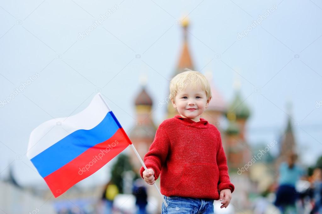 Toddler boy holding russian flag — Stock Photo © mary_smn 120436710