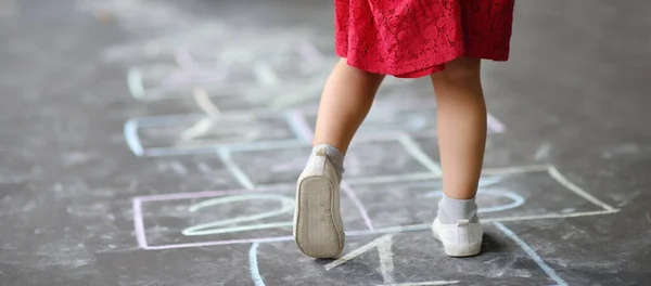 Closeup Little Girl Legs Hop Scotch Drawn Asphalt Child Playing — Stock Photo, Image