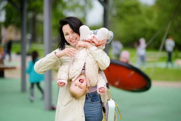 Toddler Girl Having Fun Outdoor Playground Merry Young Mother Swinging — Stock Photo, Image