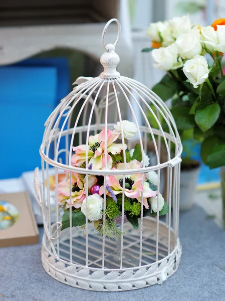 White cage with flowers — Stock Photo, Image