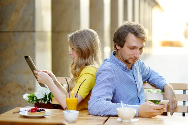 Young couple in the outdoor cafe