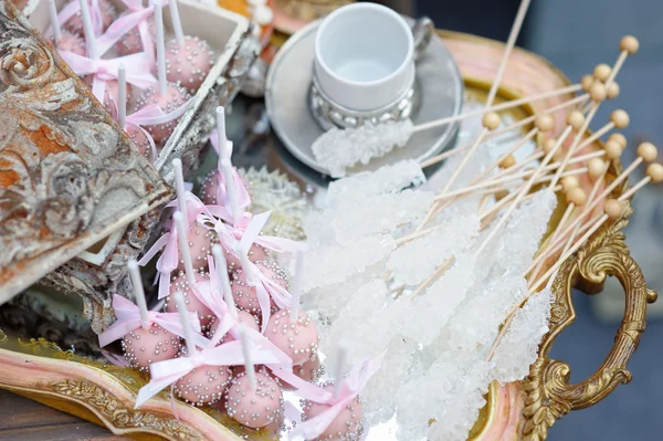 Sugar on sticks and pink pop cakes — Stock Photo, Image