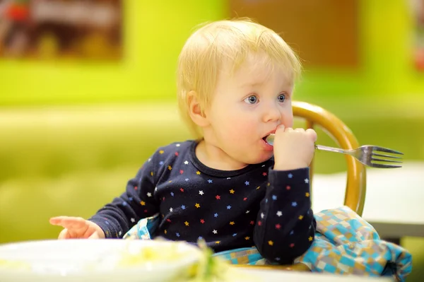 Toddler boy at the indoors cafe — Stock Photo, Image