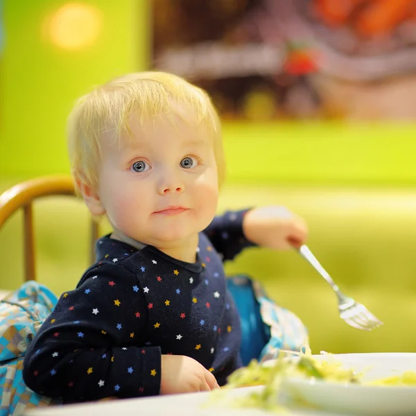 Toddler boy at the indoors cafe — Stock Photo, Image