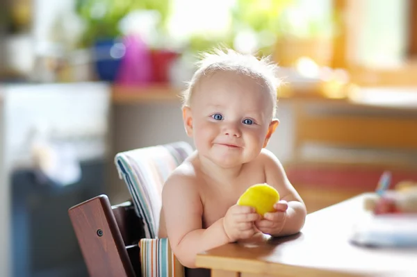 Funny baby eating healthy food — Stock Photo, Image