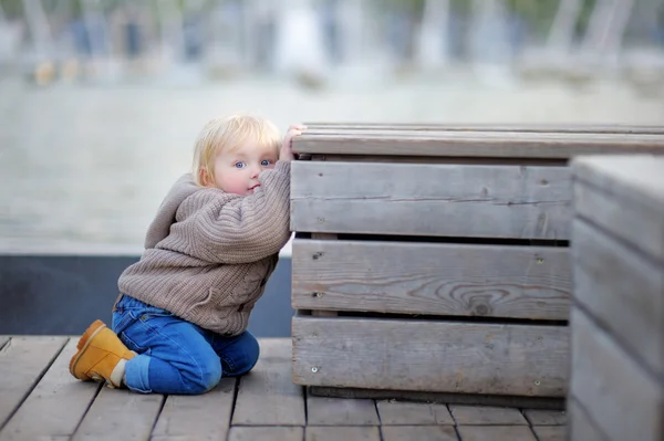 Toddler boy playing outdoors — Stock Photo, Image