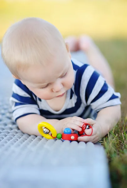 Baby play with bright toy — Stock Photo, Image