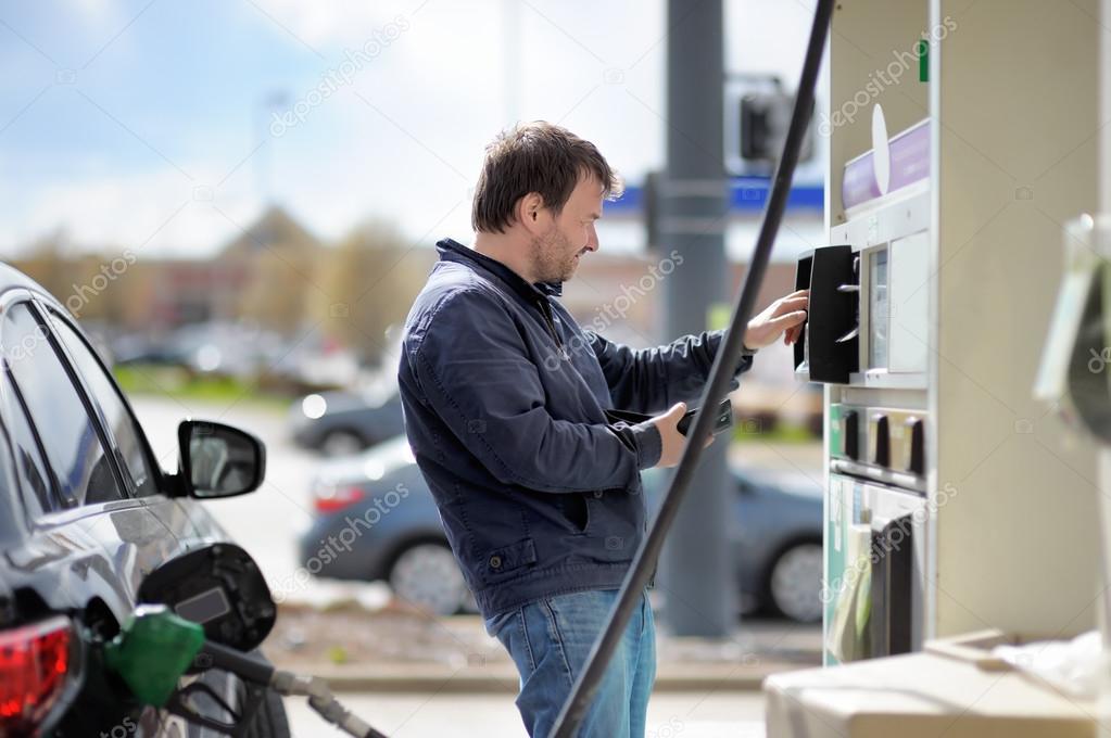 Man filling gasoline fuel 