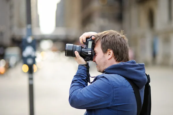 Photographer taking photo with professional digital camera — Stock Photo, Image