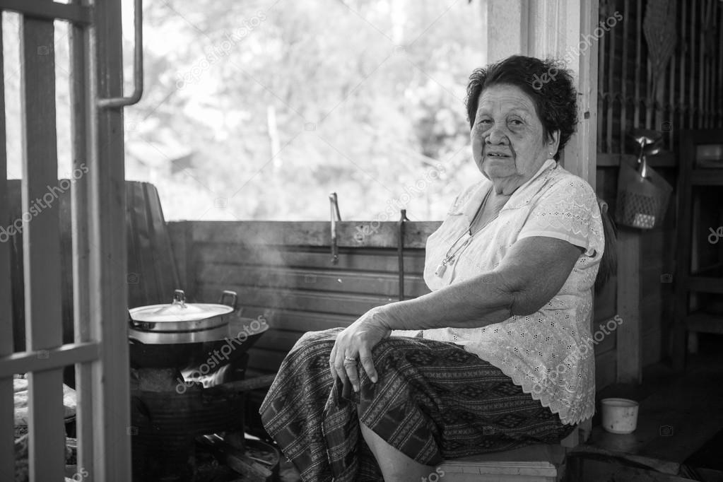 Senior asian woman cooking in kitchen