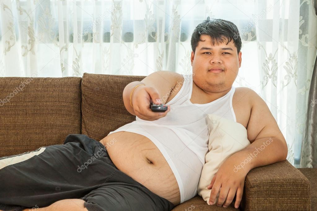 Overweight guy to watch some TV