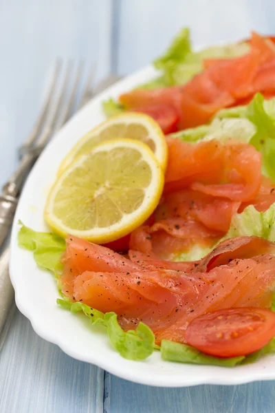 Salad with salmon on white dish — Stock Photo, Image