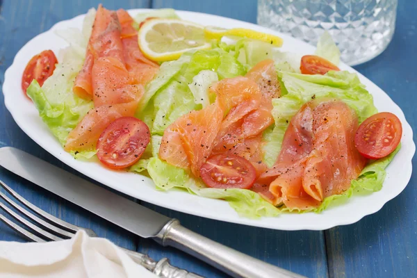 Salad with smoked salmon on white dish — Stock Photo, Image