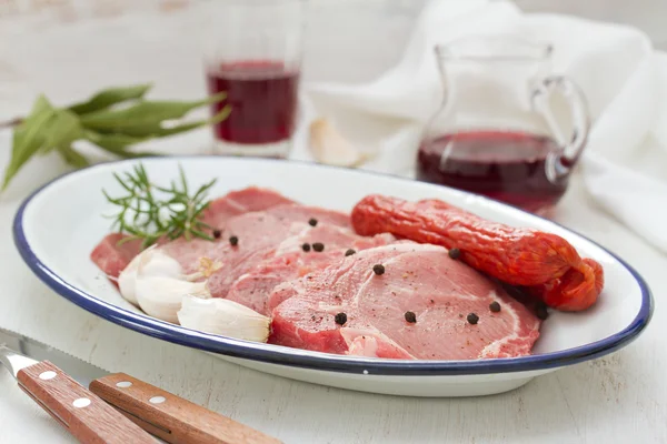 Pork with smoked sausages and garlic — Stock Photo, Image