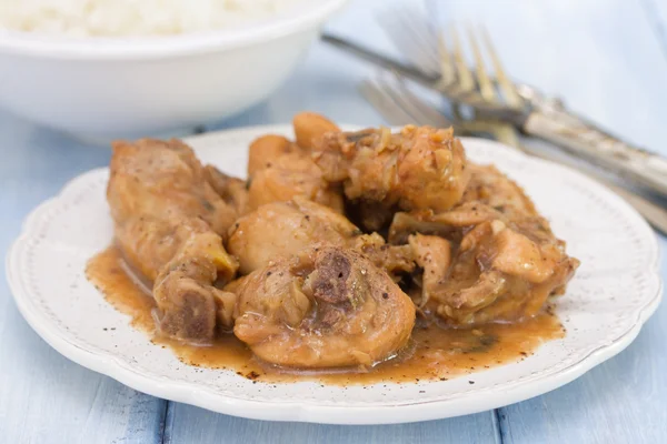 Boiled chicken with beer sauce in white plate — Stock Photo, Image